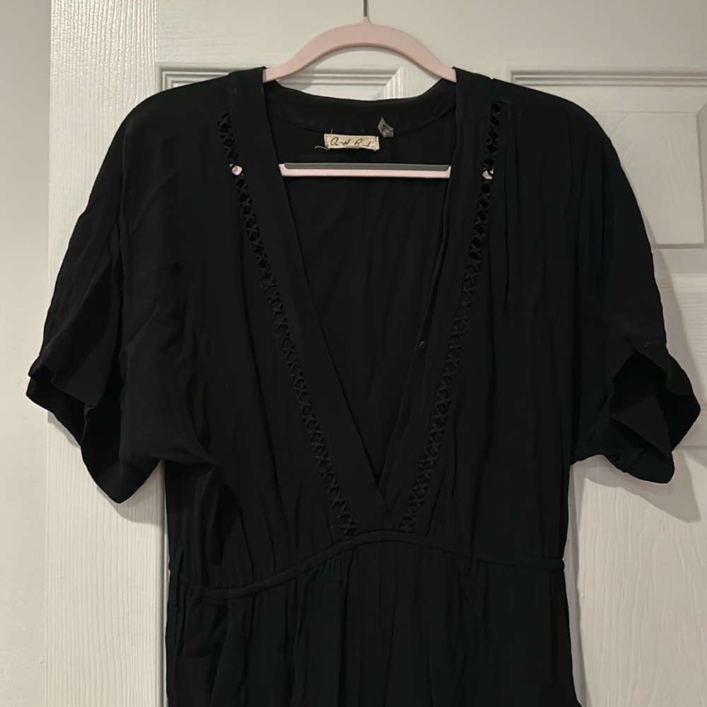 Black jumpsuit small on the road